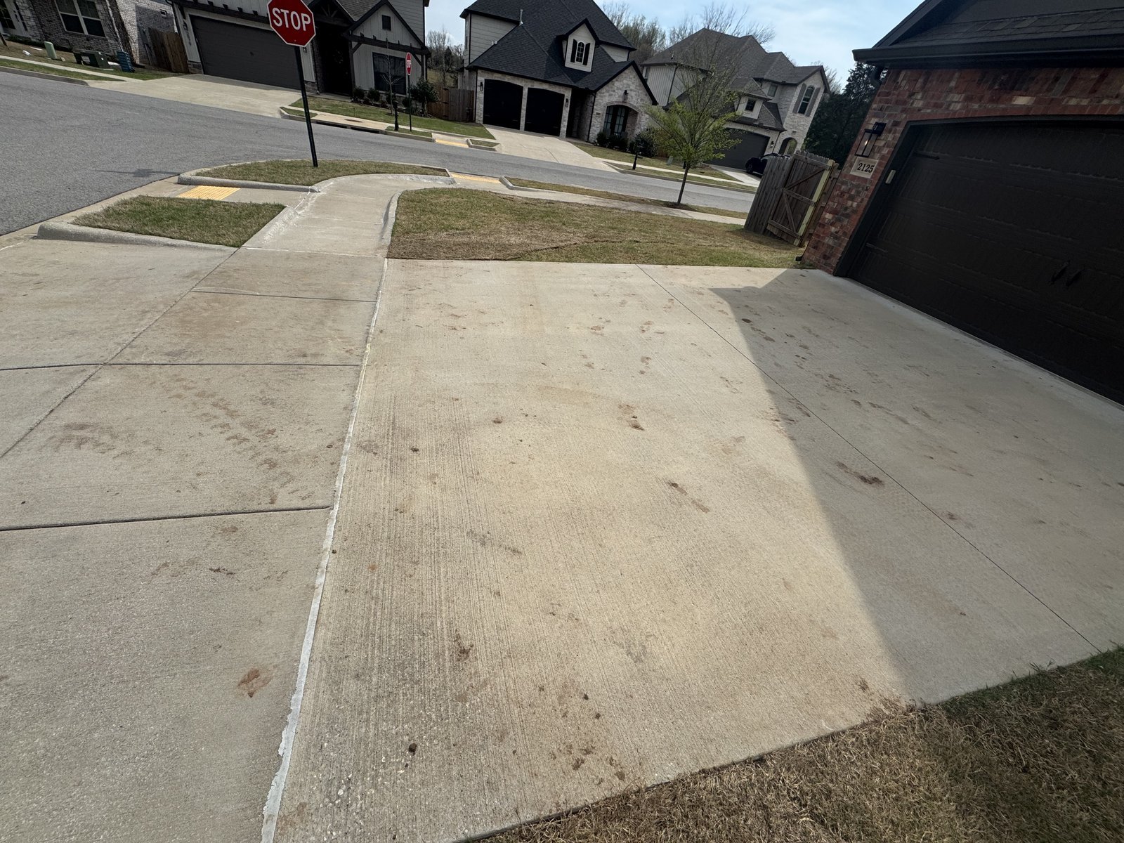 Suburban driveway before pressure washing
